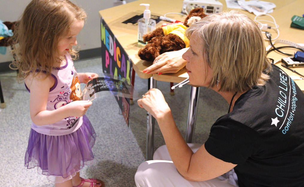 OR Nurse interacting with children