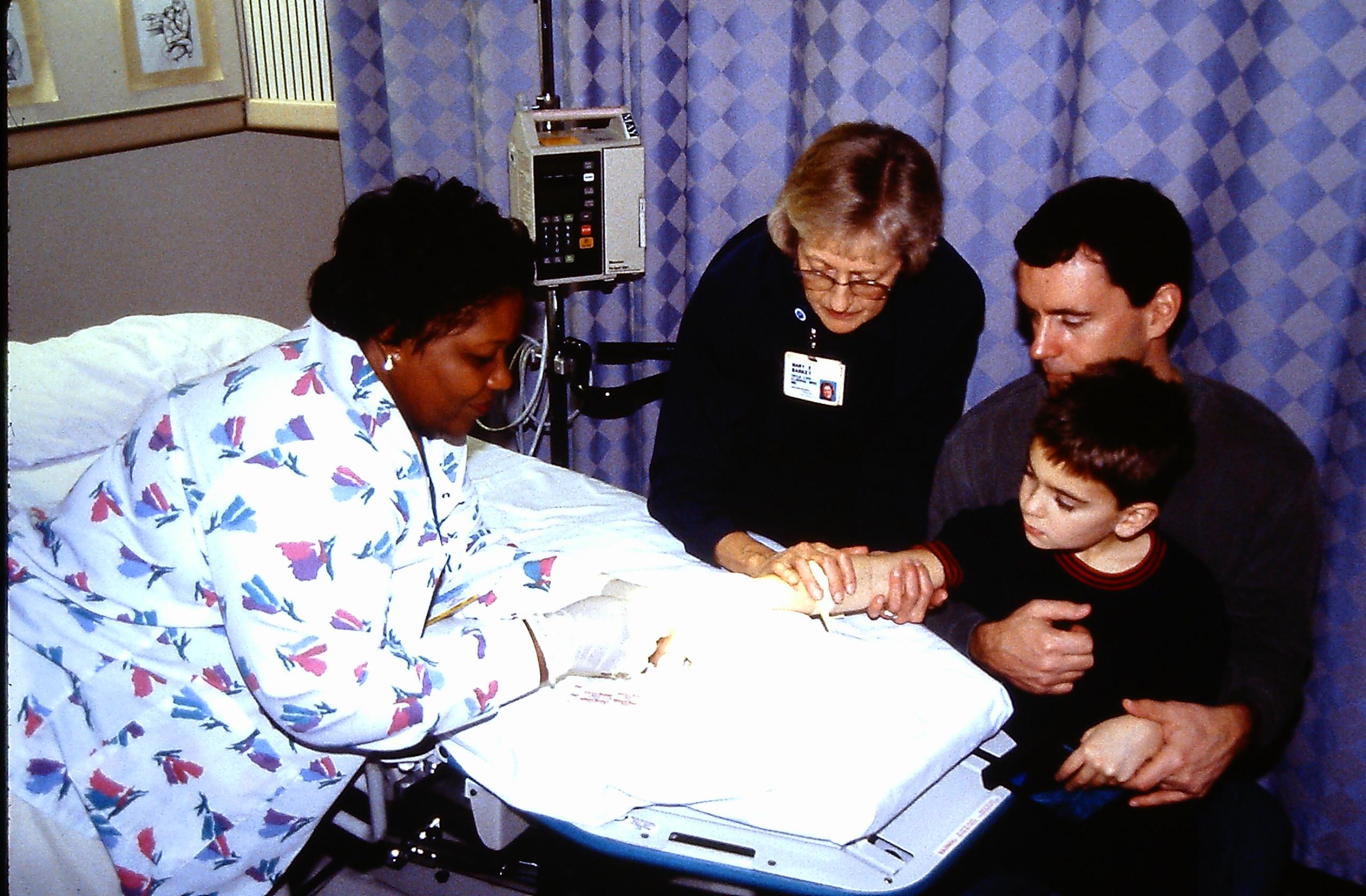 MEB &amp; Laundra Slaughter, RN (Comfort Posiitoning ; back-to-chest ; watching ; treatment room)