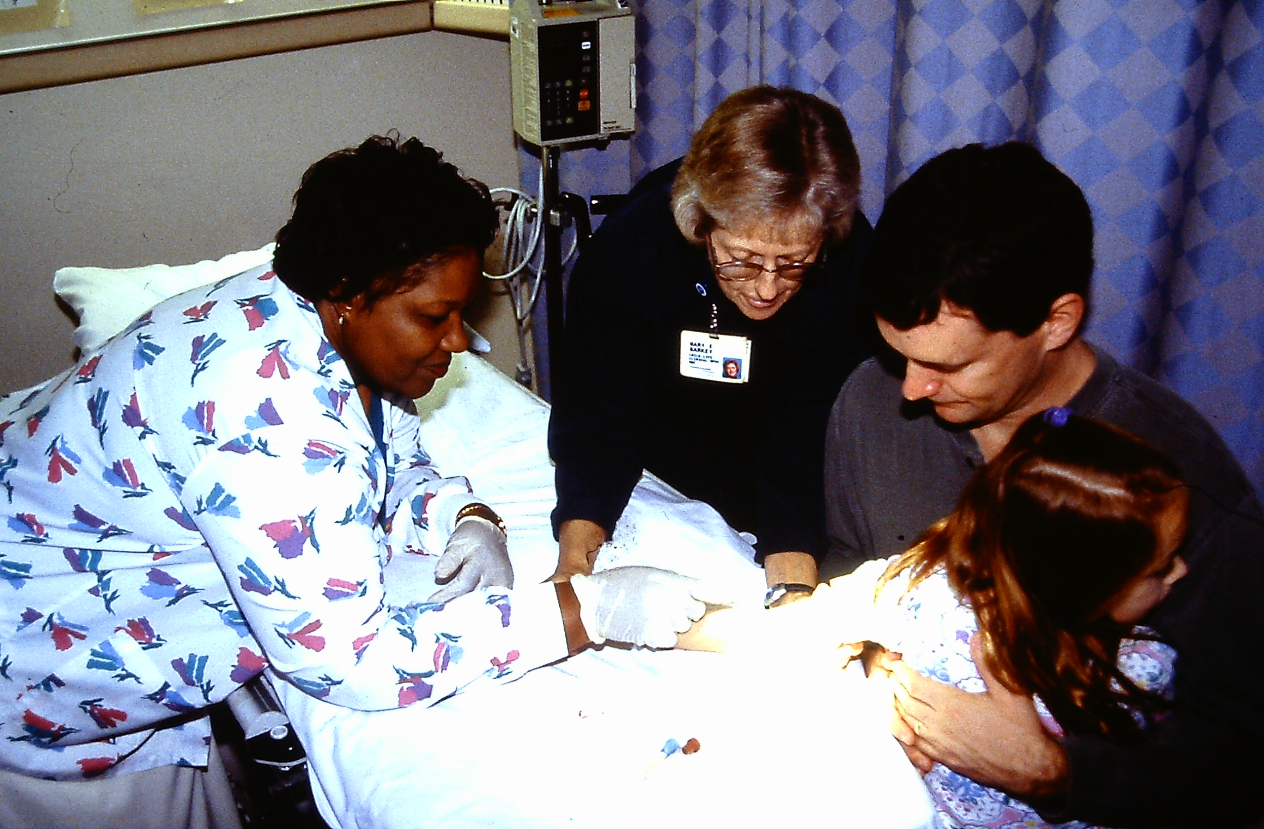 MEB &amp; Laundra Slaughter, RN (Comfort Positioning ; chest-to-chest ; looking away ; treatment room)